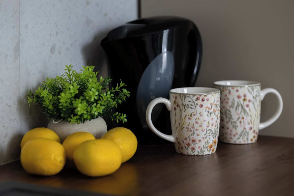 Tasteful kitchen detail with coffee set and fresh decorative accents.