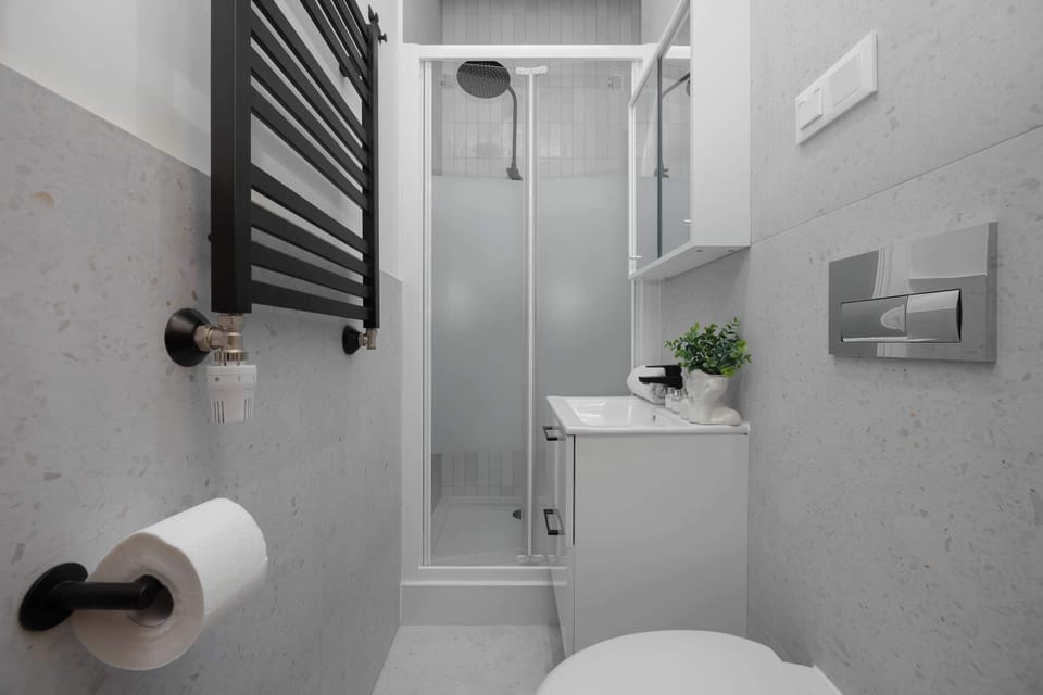 Clean bathroom with a shower and minimalist design.