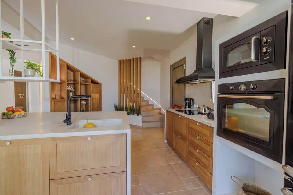 A fully equipped gourmet kitchen with sleek modern finishes