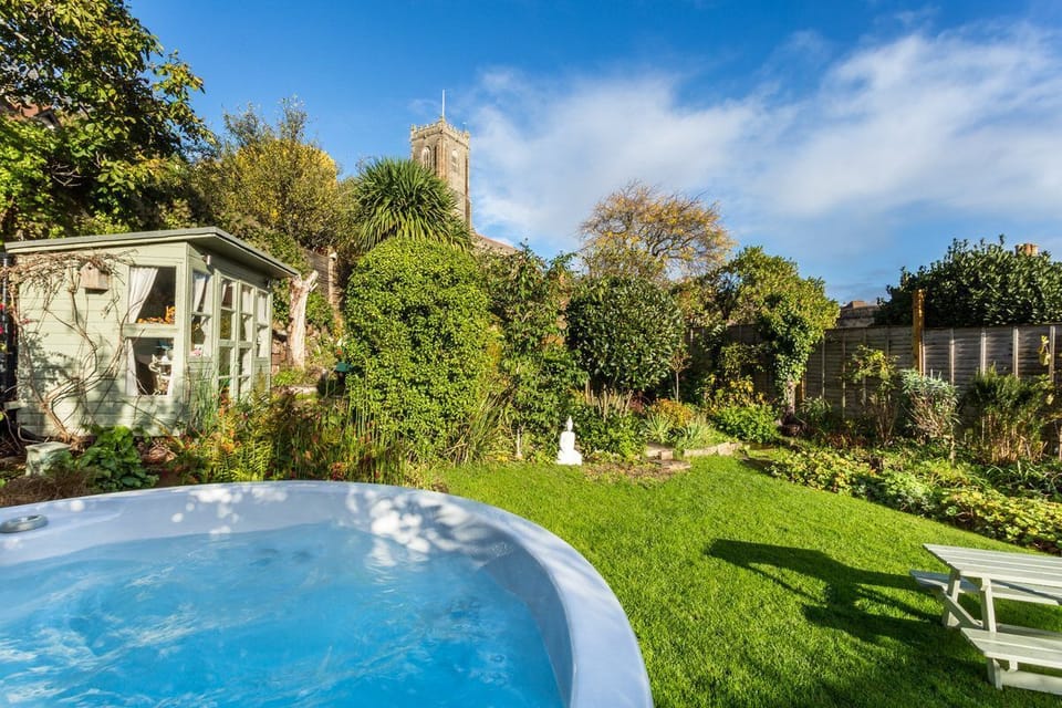 Relax in style in your private hot tub, set in a secluded garden with lovely views.