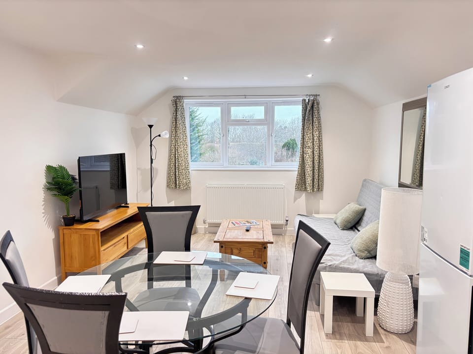 Apartment, 1 Bedroom | Living room | Flat-screen TV
