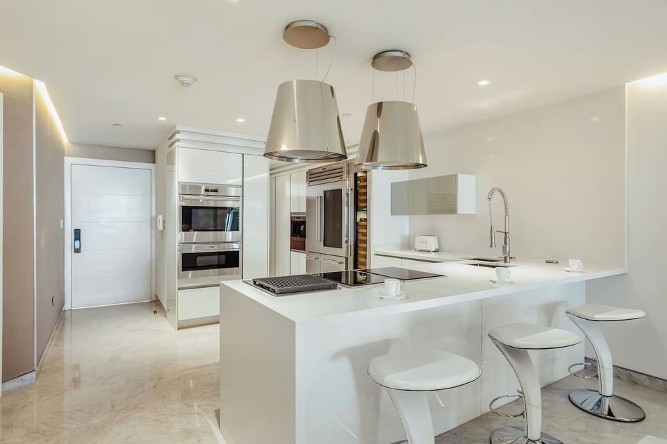 Pull up a stool and settle in—this sleek, fully equipped kitchen invites you to start your day with coffee, cook at your own pace, and enjoy every moment like you’re right at home.