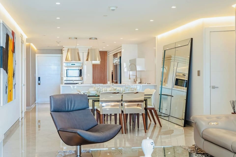Step into this bright, open living space where everything flows effortlessly—from relaxing on the sofa to sharing meals just steps away. It’s an inviting place to unwind, connect, and truly feel at home during your stay.