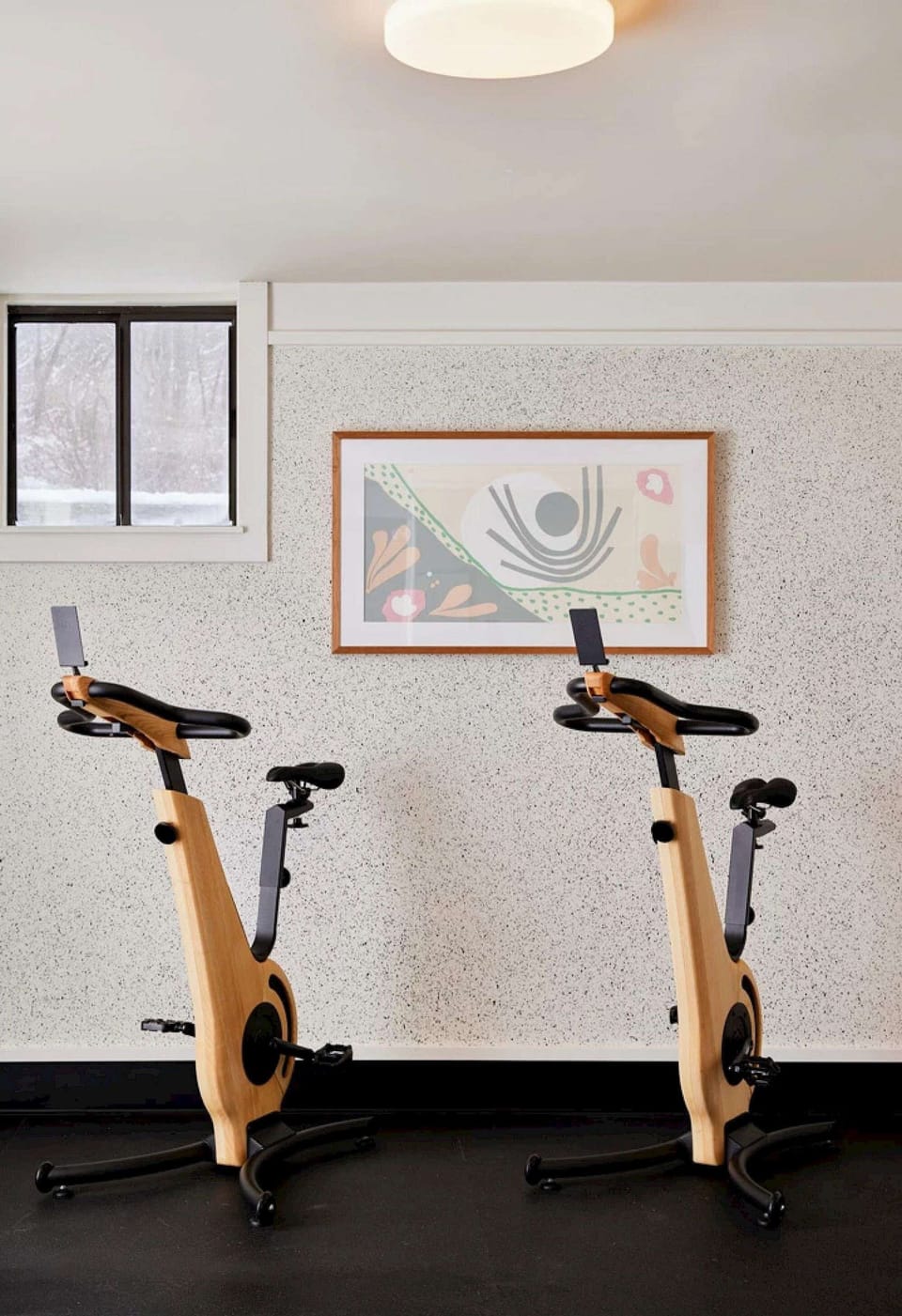 Fitness room with stationary bikes and clean, bright space