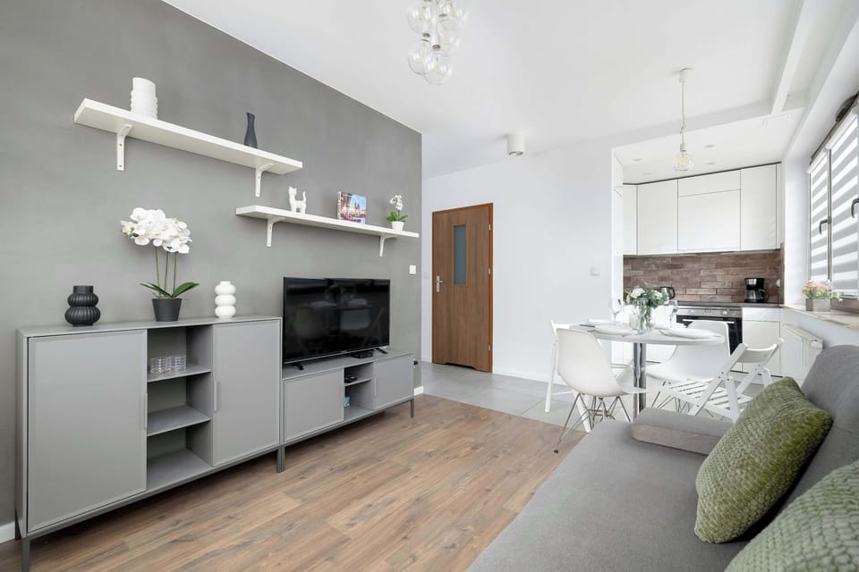 Cozy seating area with a flat-screen TV, perfect for relaxing after a day out.