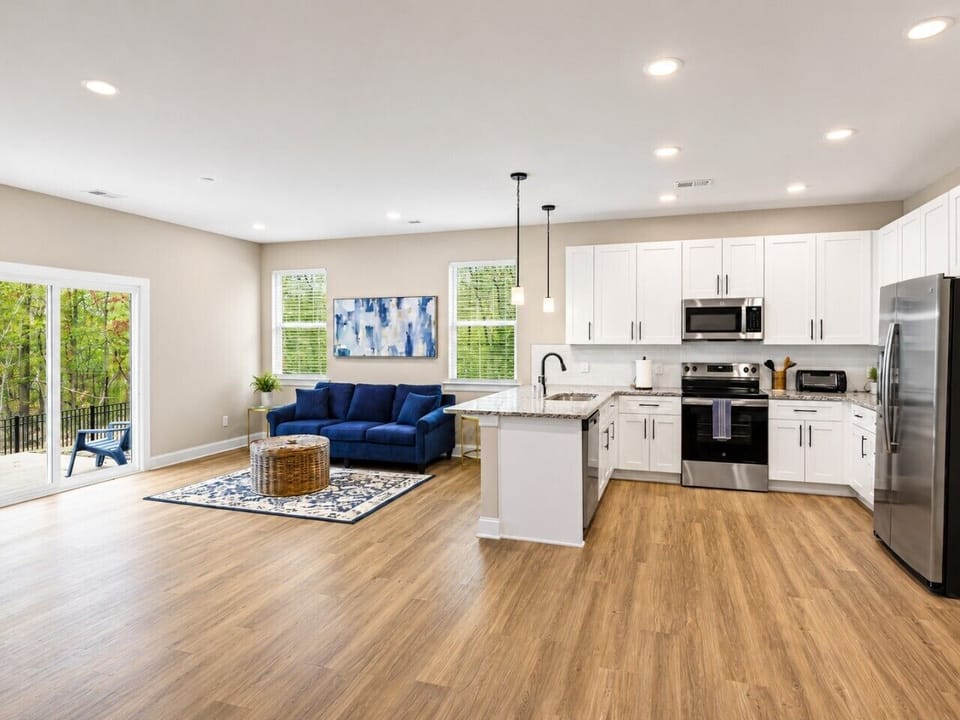 Enjoy an open floor plan featuring a fully equipped kitchen, comfortable seating, and plenty of natural light throughout.