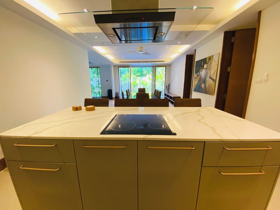 Well-equipped kitchen with stove and cabinetry