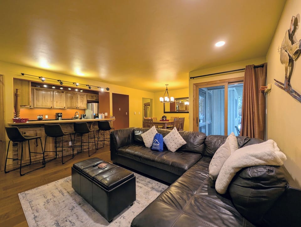 Sink into soft leather seating while your group prepares meals in the open kitchen, creating perfect moments together.