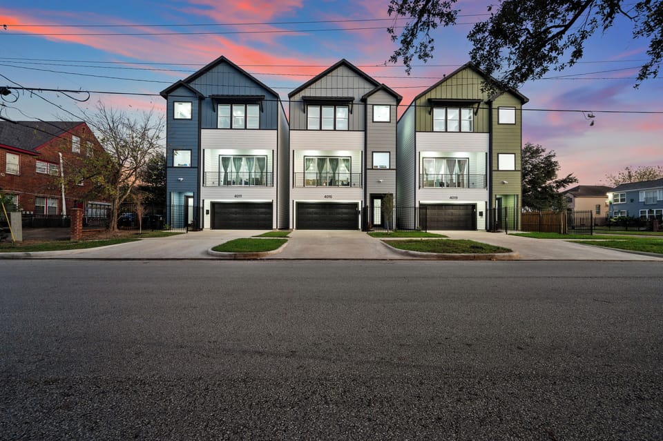 Adjacent modern townhomes with garages, perfect for larger groups