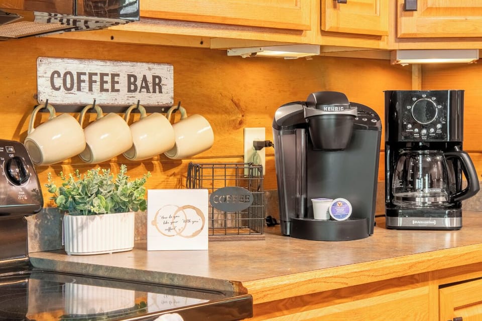 Start your mornings right with your own in-room coffee bar, complete with Keurig and drip coffee makers, charming mugs, and everything you need for that perfect cup.