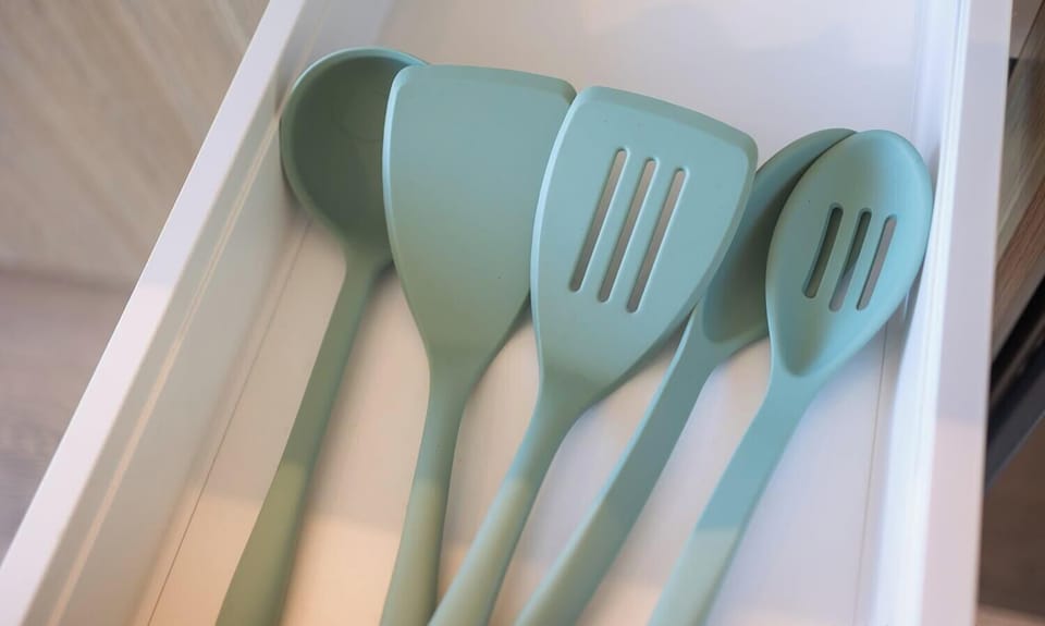 Kitchen utensils drawer with spatulas and cooking tools.