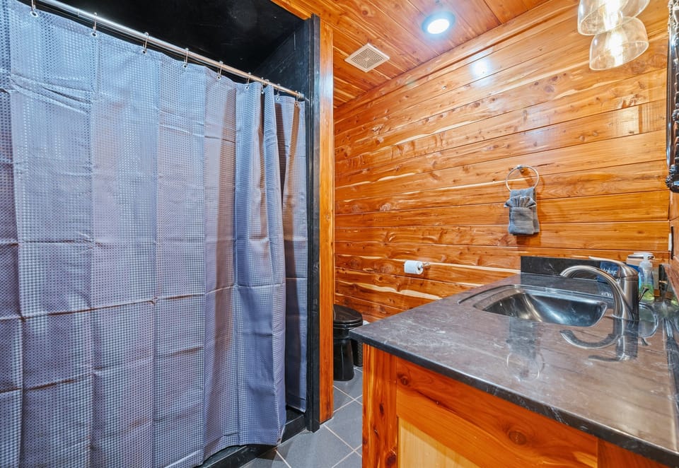Designed with group stays in mind, this bathroom layout allows for comfortable shared use without feeling cramped.