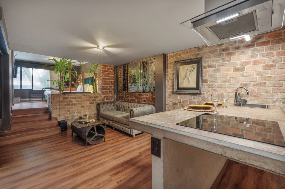 Deluxe Studio, City View | Living room | 50-inch flat-screen TV with digital channels, Netflix