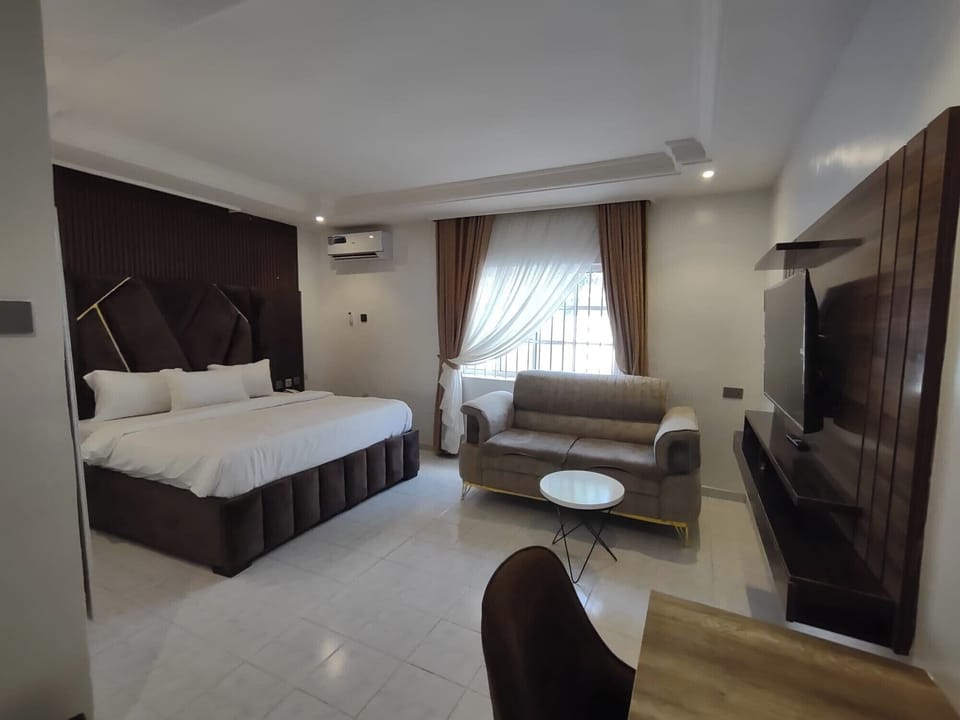 Deluxe Room, Balcony, City View | Desk, laptop workspace, blackout drapes, soundproofing