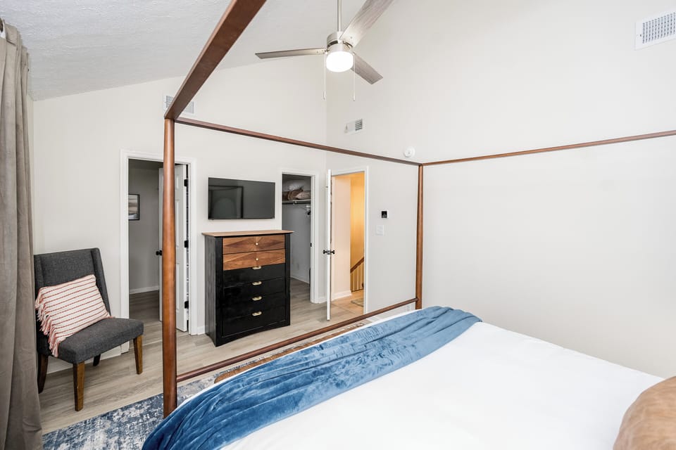 Attached bathroom is steps away from bed. 