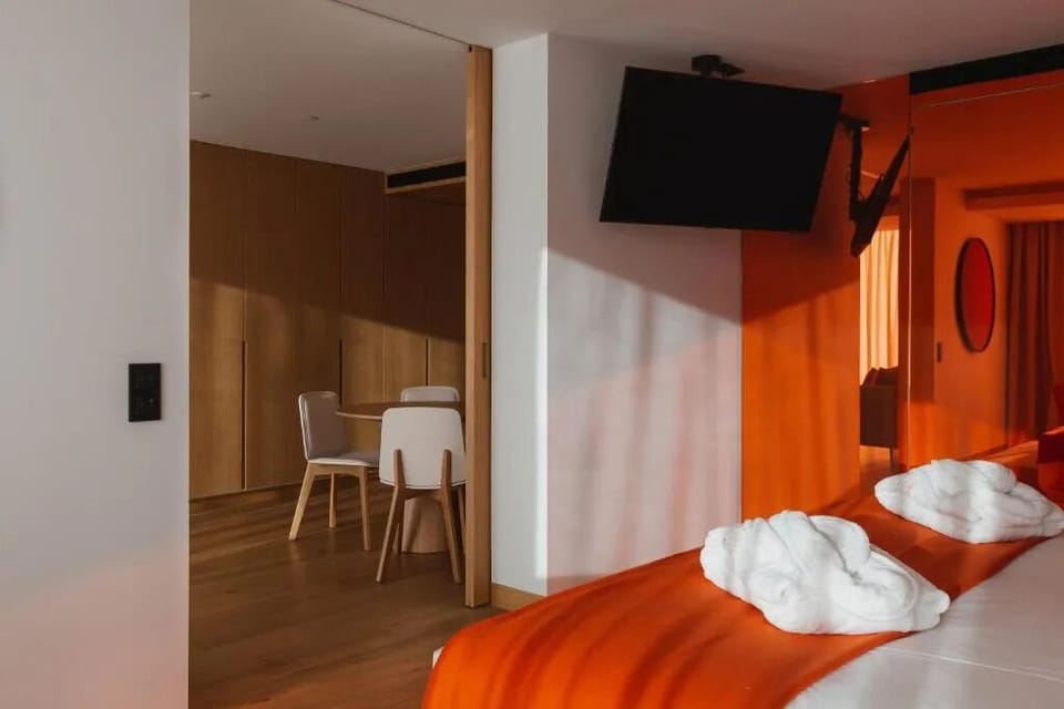 Kick back with in-room entertainment and space to dine nearby.