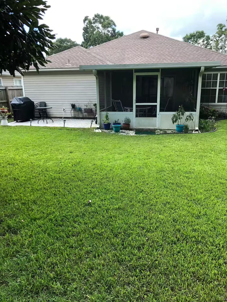 Screened in porch and a fenced in yard for enjoyable outside times