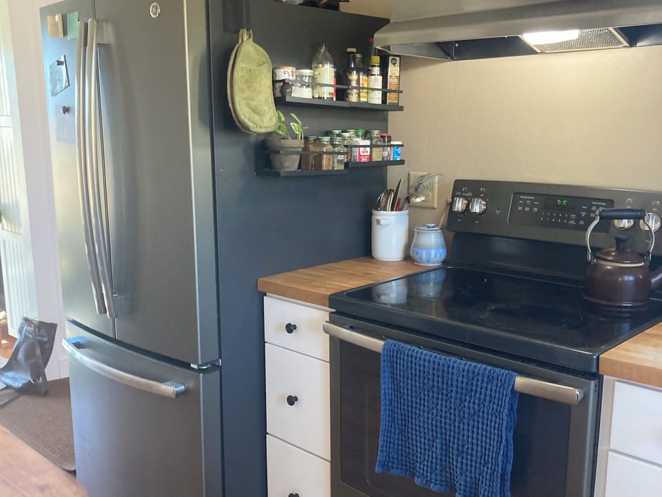 French door refrigerator and glass-top cookstove