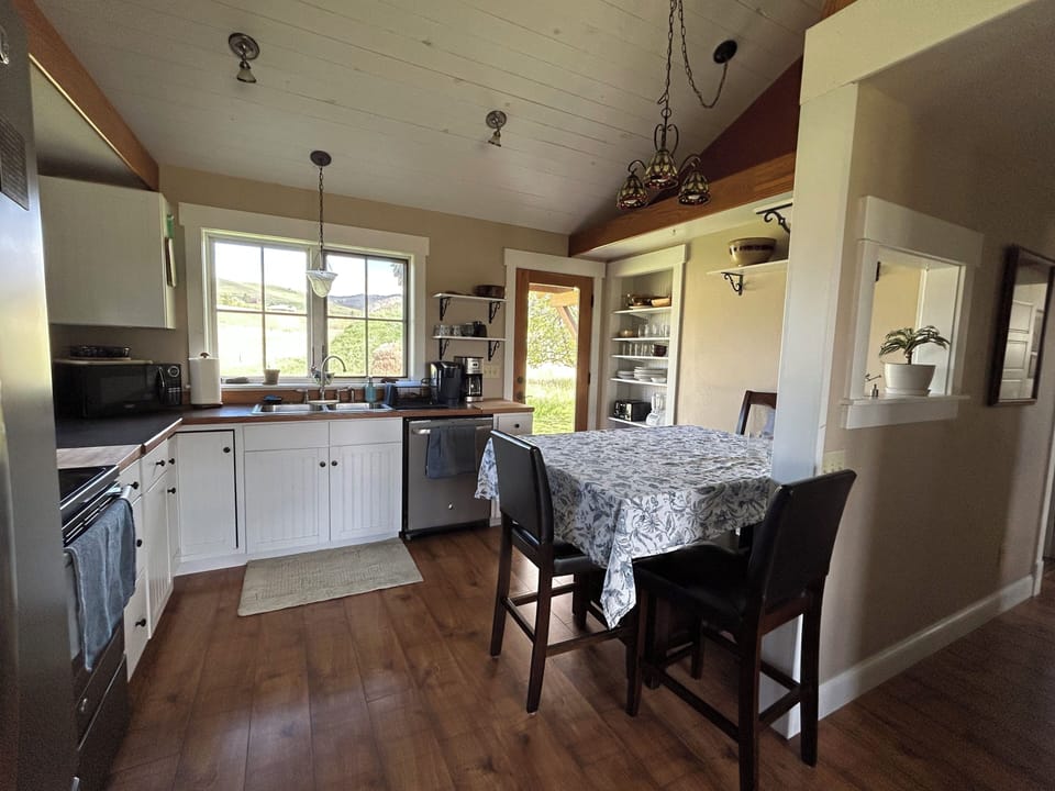 Natural light floods the kitchen and dining area