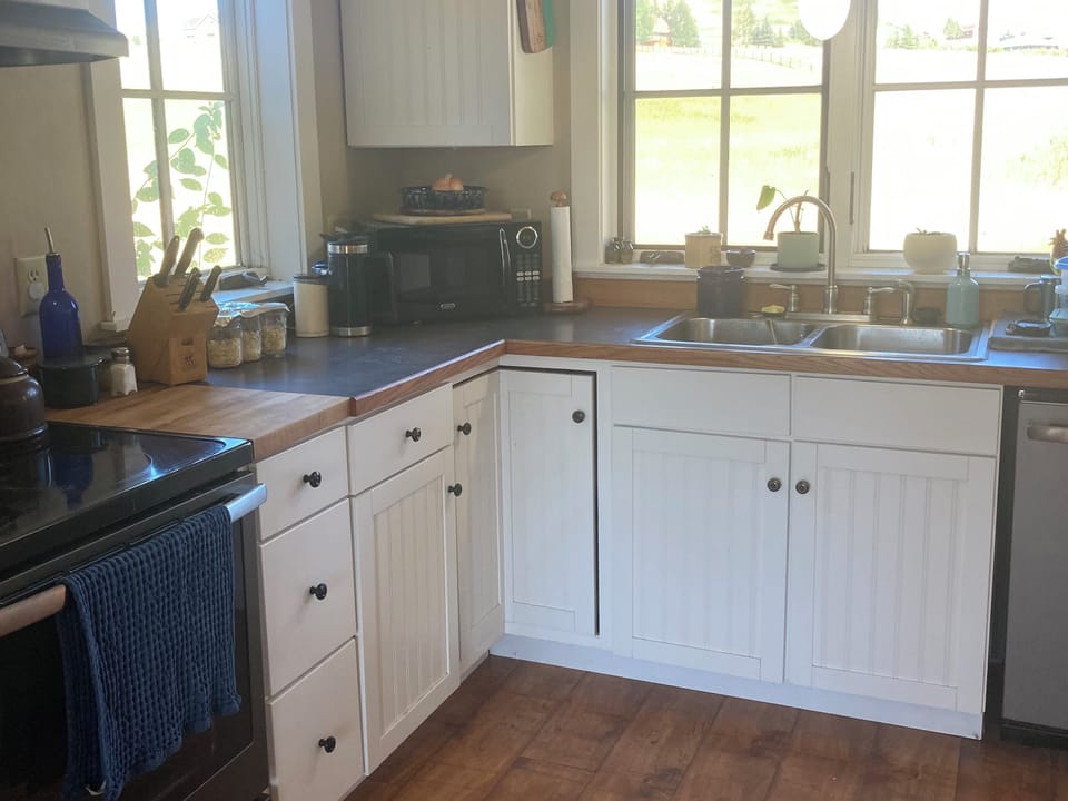 Kitchen is well stocked with quality cookware, bakeware, and small appliances