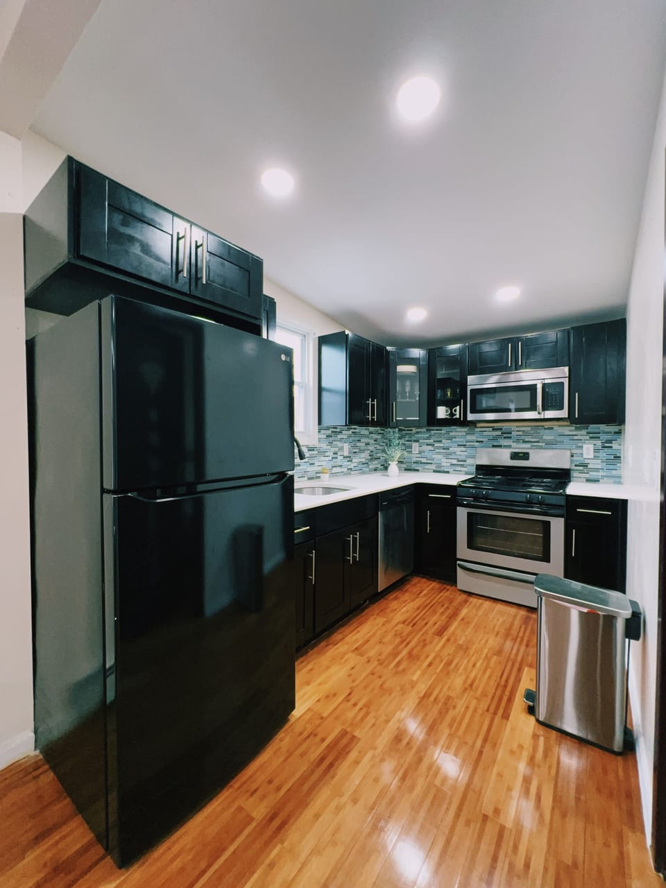 Kitchen area-ample storage includes cooking and dinnerware.