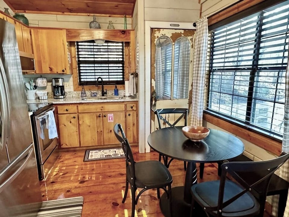 Full kitchen. Fridge with ice maker.Stack W/D behind antique door. Seating for 4