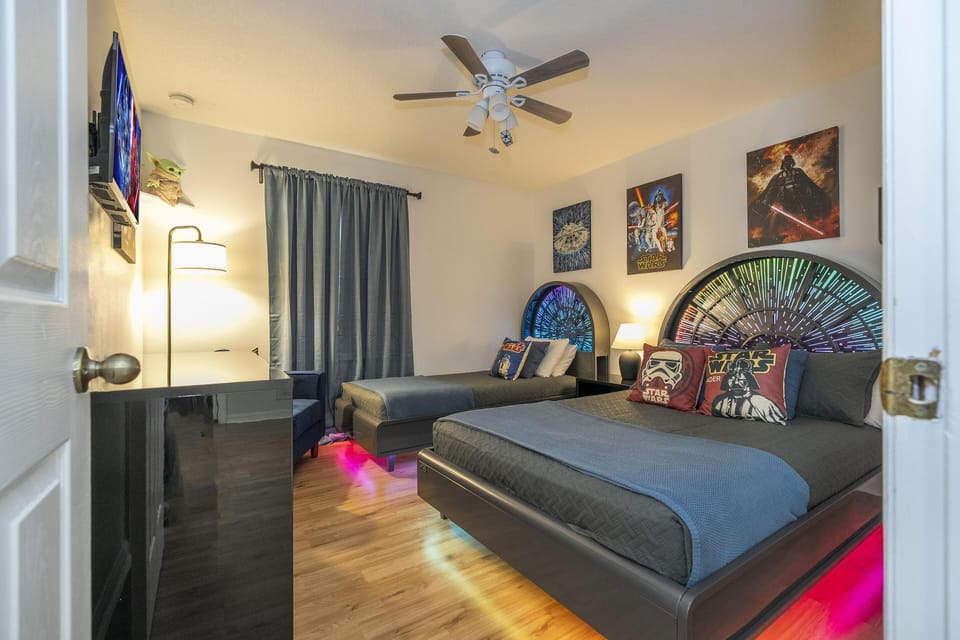 Second floor Cozy twin bedroom with vibrant LED lighting and arcade game
