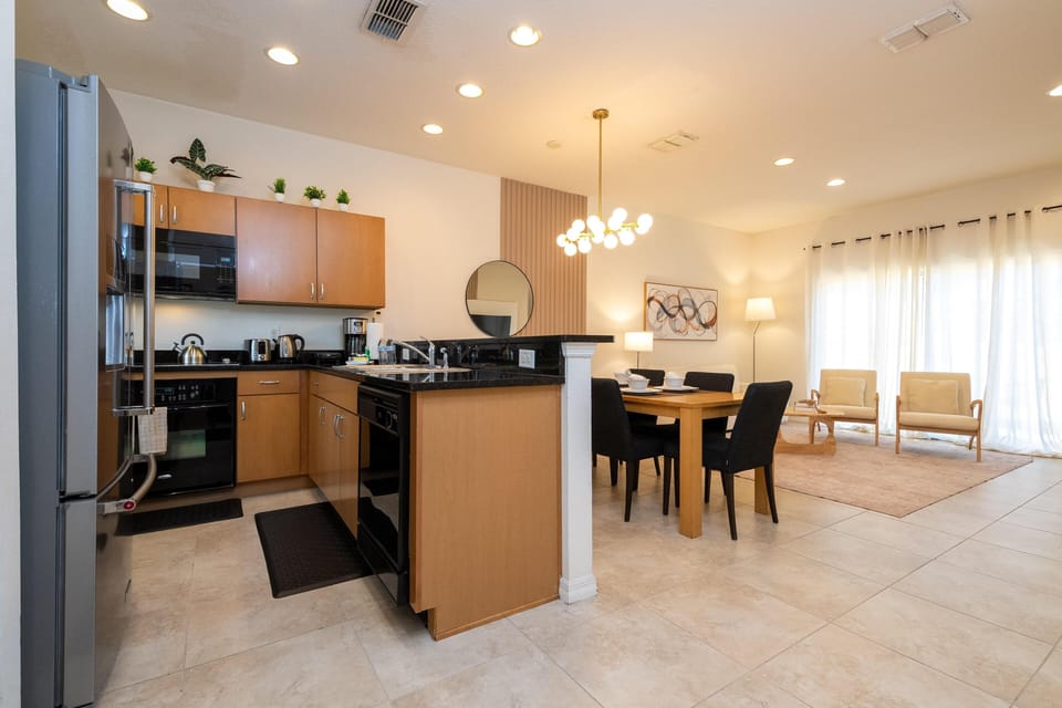 Modern kitchen and dining area with open, airy layout