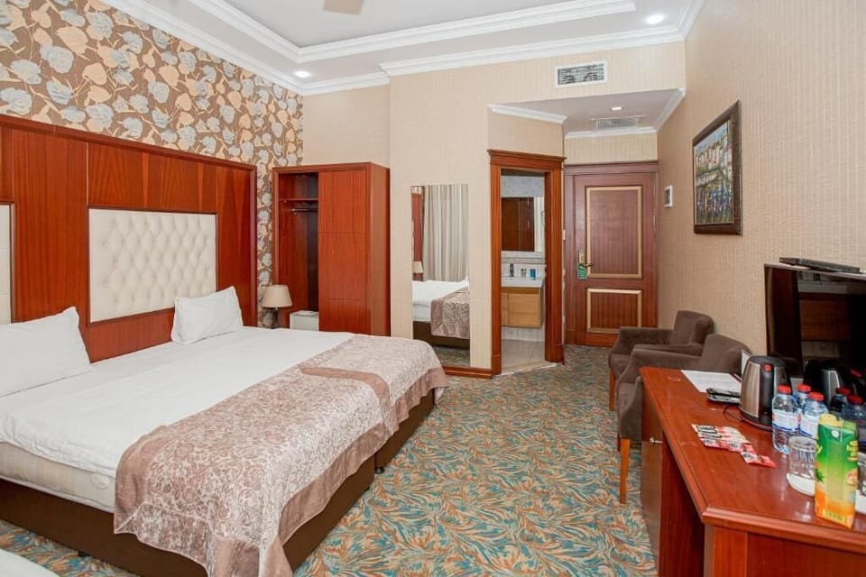 Comfort Triple Room, City View | In-room safe, desk, laptop workspace, iron/ironing board