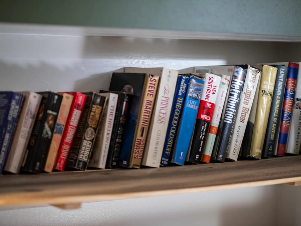 Bookshelf detail w/ a variety of reads for quiet moments