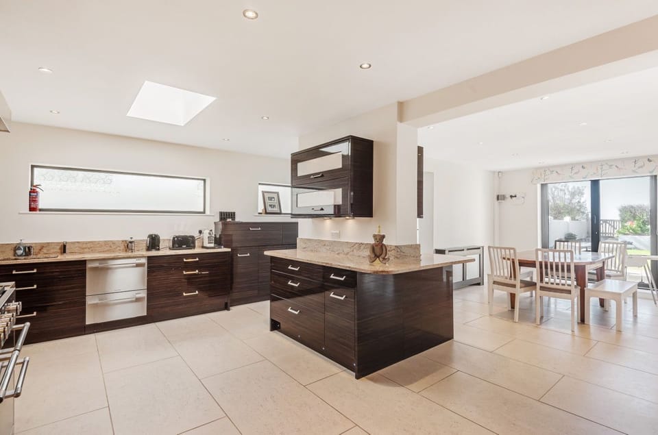 Kitchen and dining area leading on to the secure and private beach front garden