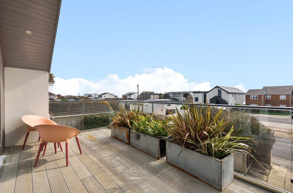 Balcony with outdoor seating with sea views