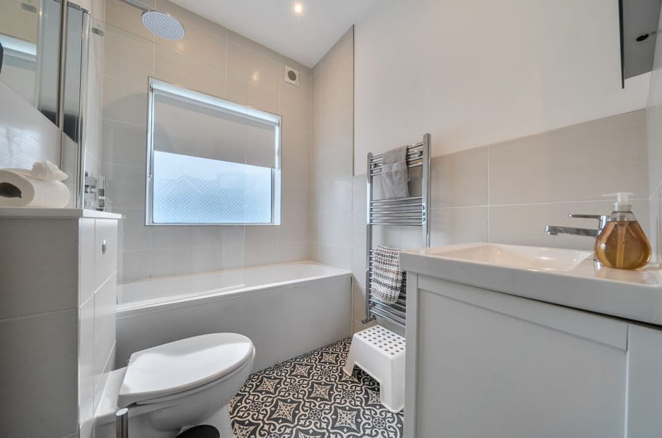 Downstairs bathroom with over bath shower