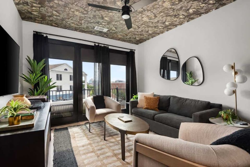 Condo: Bright living room with modern furnishings