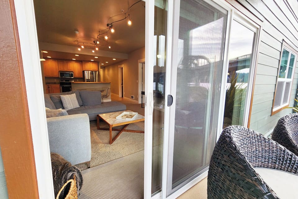 The living room opens to a nice patio to sit and watch the river.