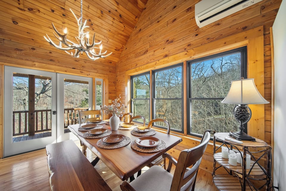 Raw Edge Wood Dining Table Surrounded by Windows