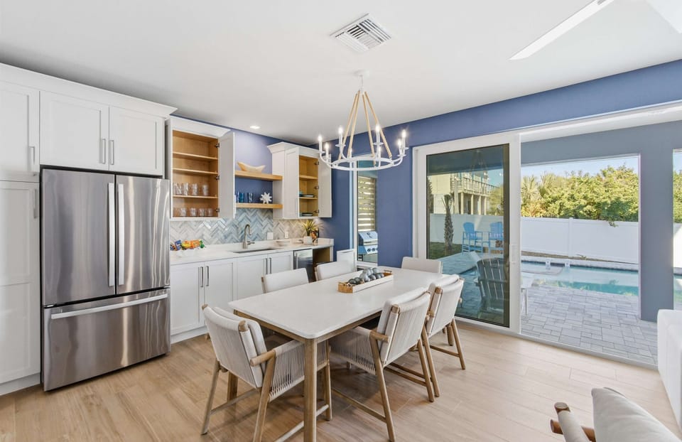 Stylish open-concept dining with pool views.