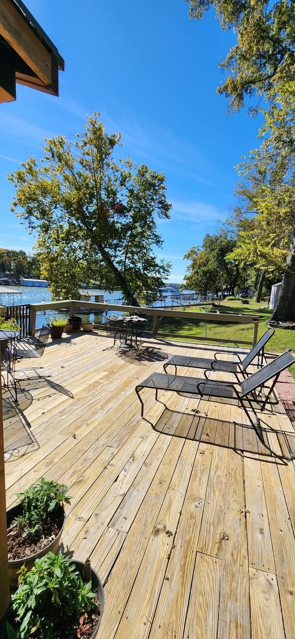 Large lakeside deck with outdoor dining area