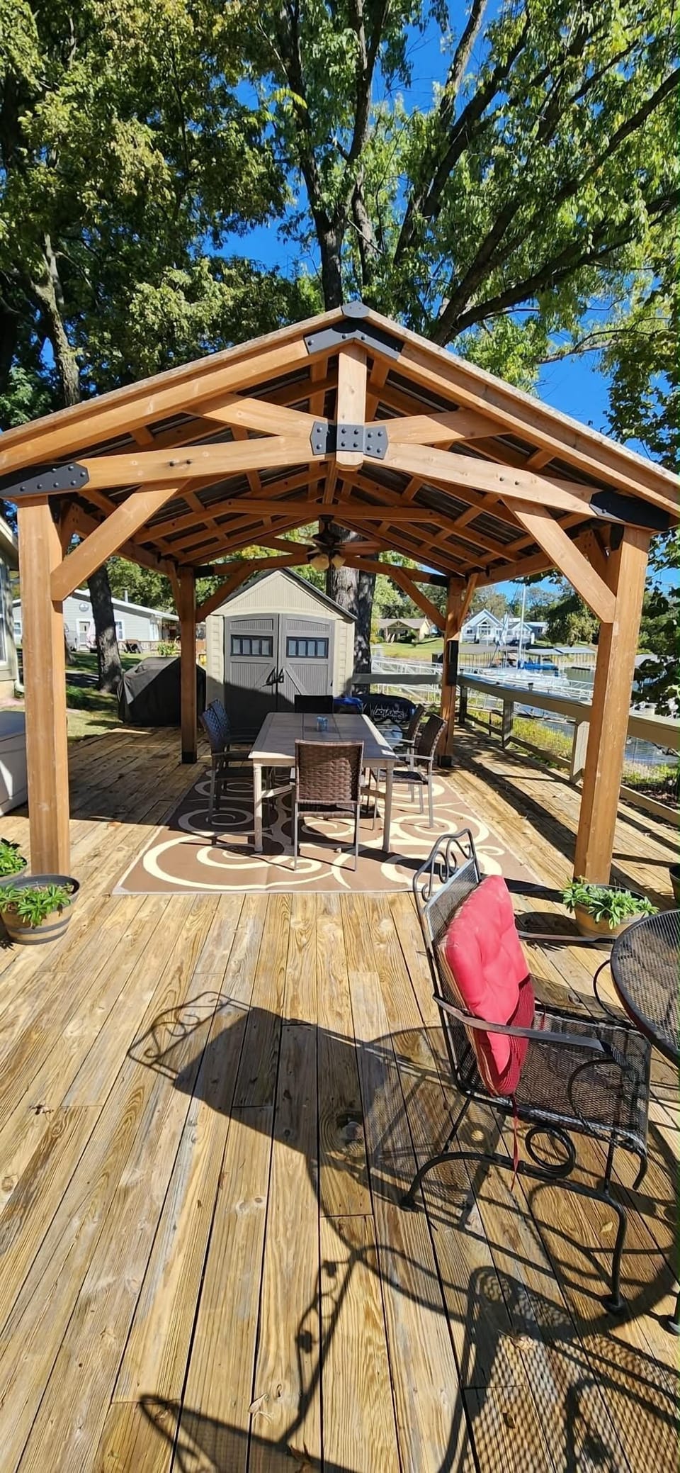 Large lakeside deck with outdoor dining area