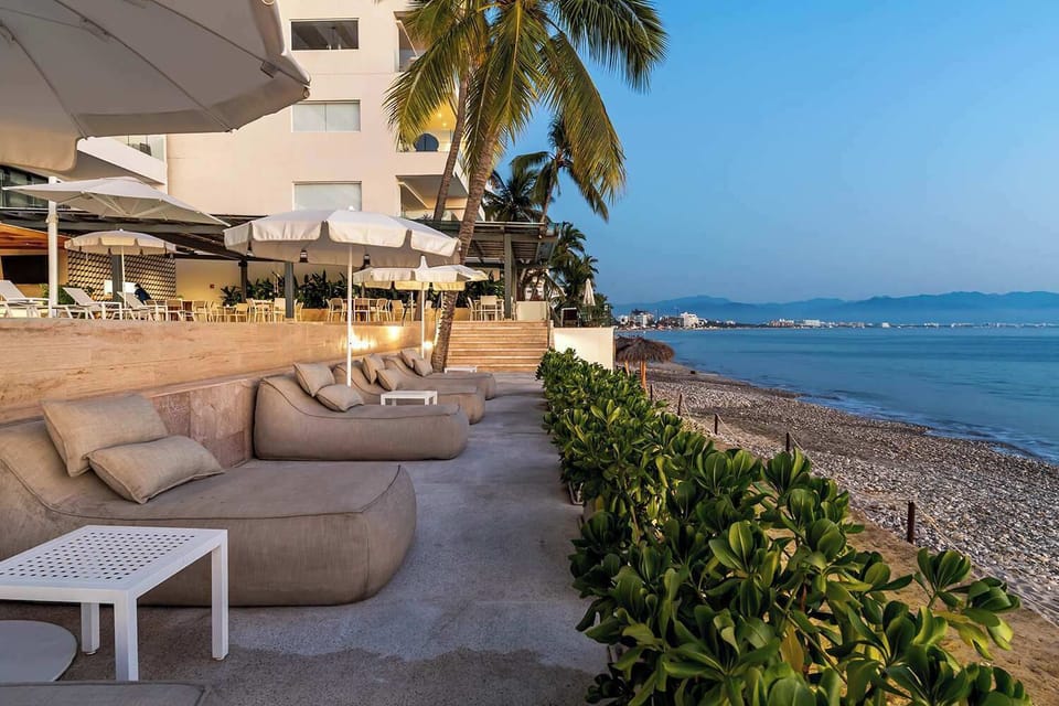 Beachside pouf loungers on an elevated terrace