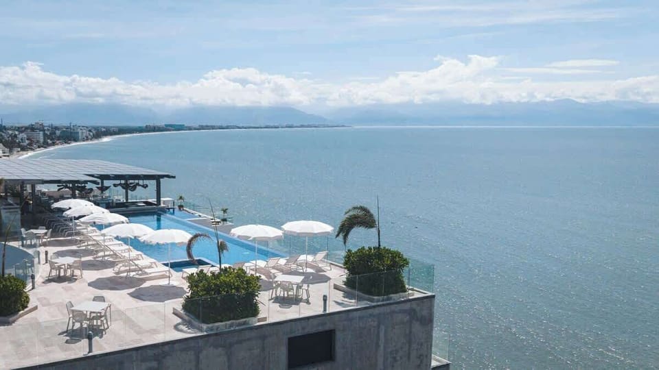 Drone view of rooftop pool and sundeck