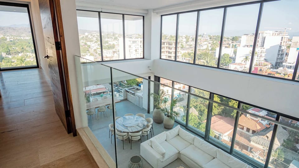Two level penthouse with city, mountain, and partial ocean views.