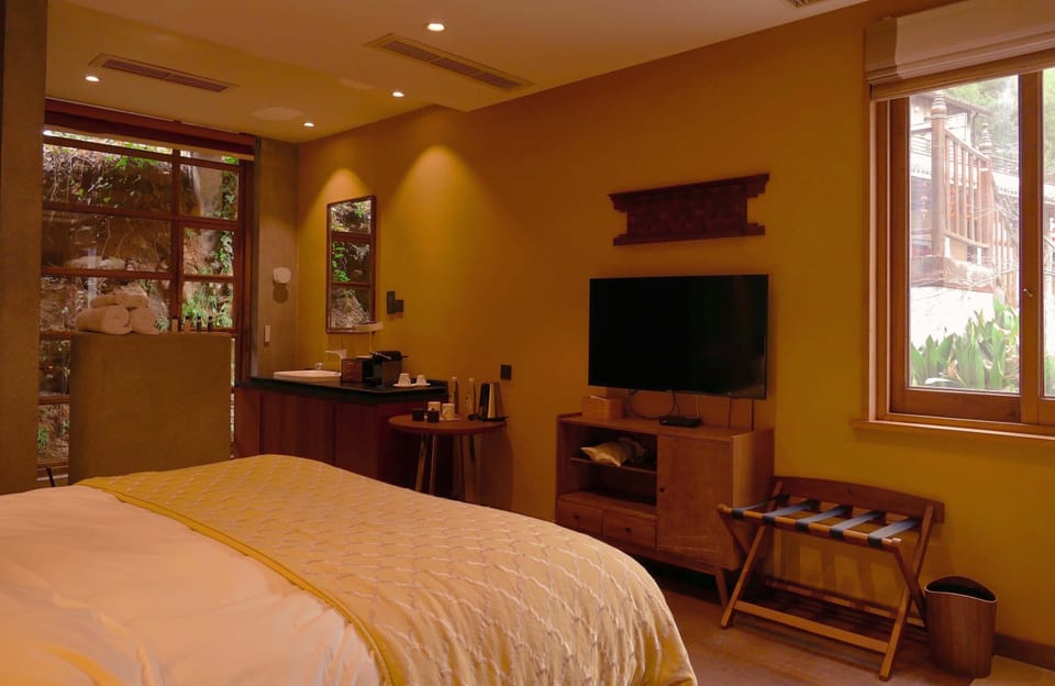 Economy Double Room, Courtyard View | Living area | TV