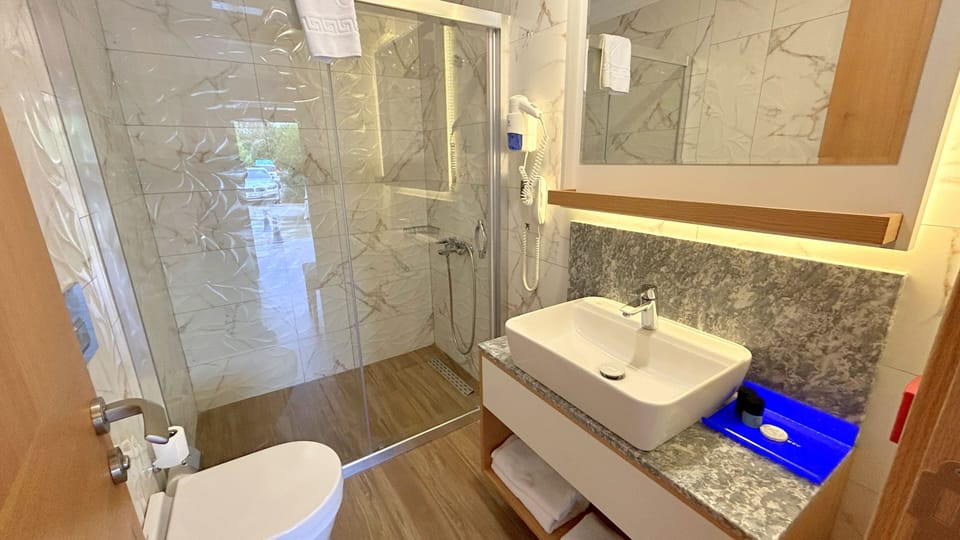 Superior Single Room, 1 Twin Bed | Bathroom | Shower, free toiletries, hair dryer, slippers