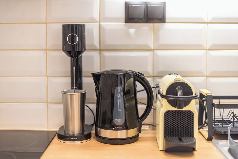 Apartment, Balcony, City View | Coffee and/or coffee maker
