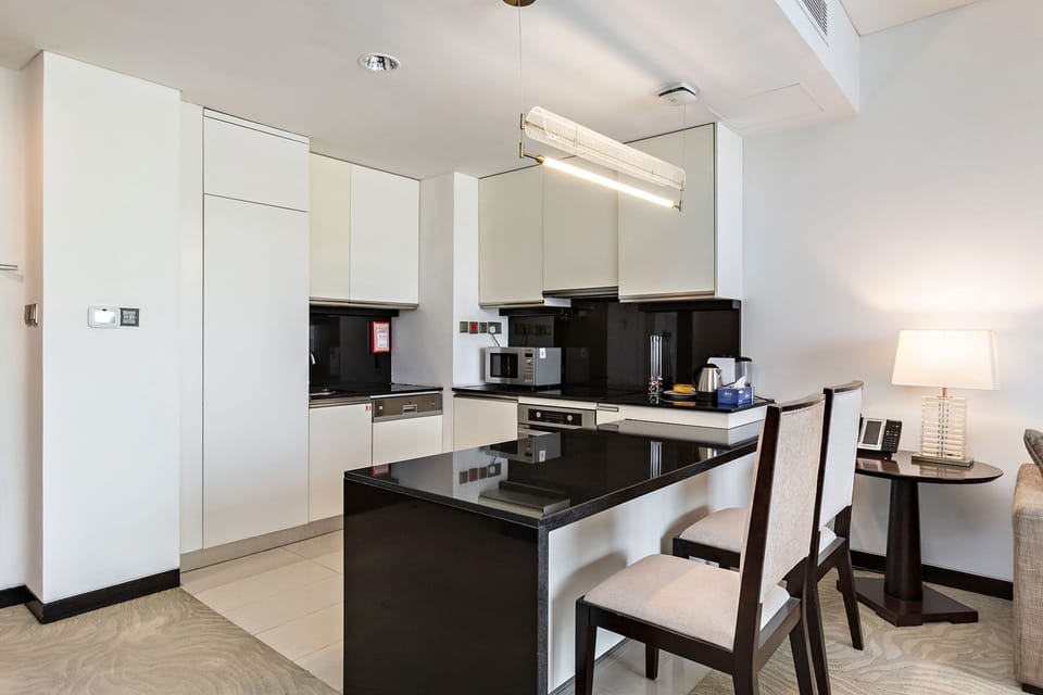 Premium Apartment, 1 Bedroom, Balcony, Canal View | Private kitchen | Espresso maker, electric kettle, toaster, cleaning supplies