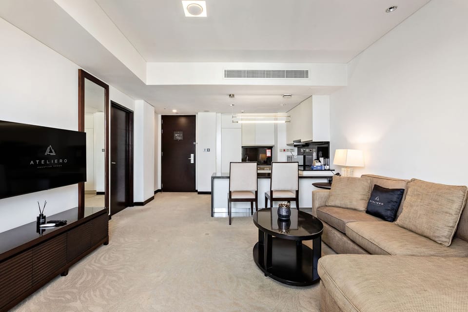 Premium Apartment, 1 Bedroom, Balcony, Canal View | Living room | 100-cm Smart TV with digital channels