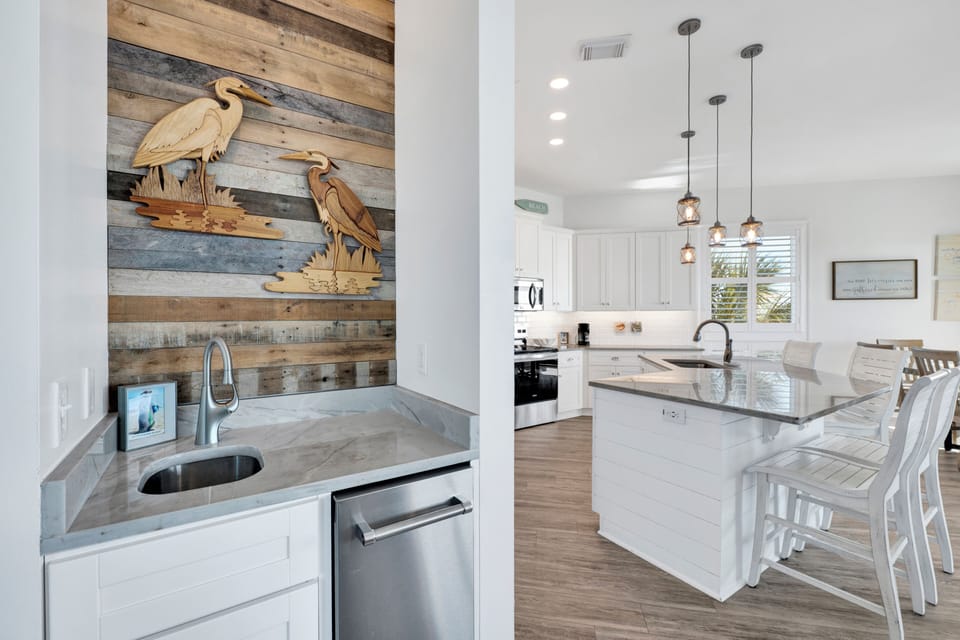 A wet-bar with a standalone ice maker for added guest convenience