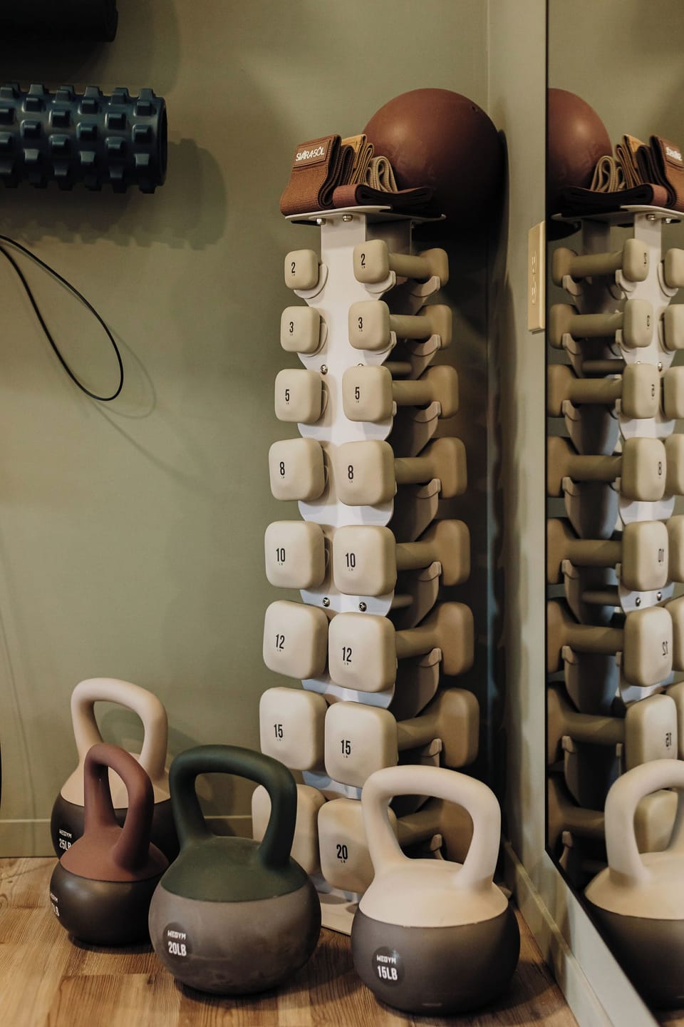 Stay strong during your getaway with this well-equipped fitness area featuring numbered dumbbells and kettlebells for your workout routine.