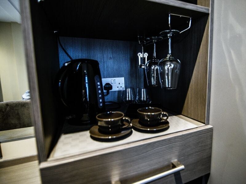 Suite, Private Bathroom | Desk, laptop workspace, blackout drapes, iron/ironing board